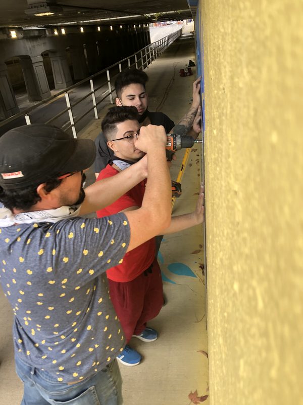 Connected in Chaos, painting the wall, London, Ontario, 2020