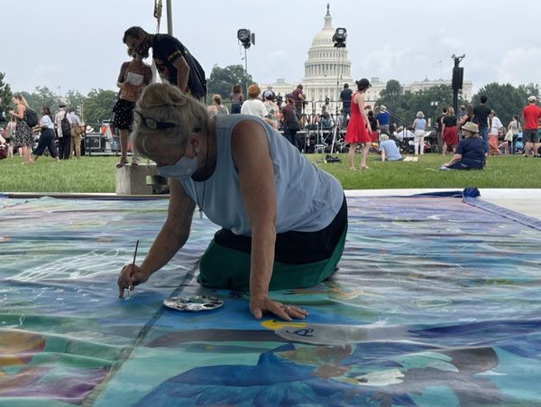 In the culture. Painting on the National Mall, Washington DC, E Ala E